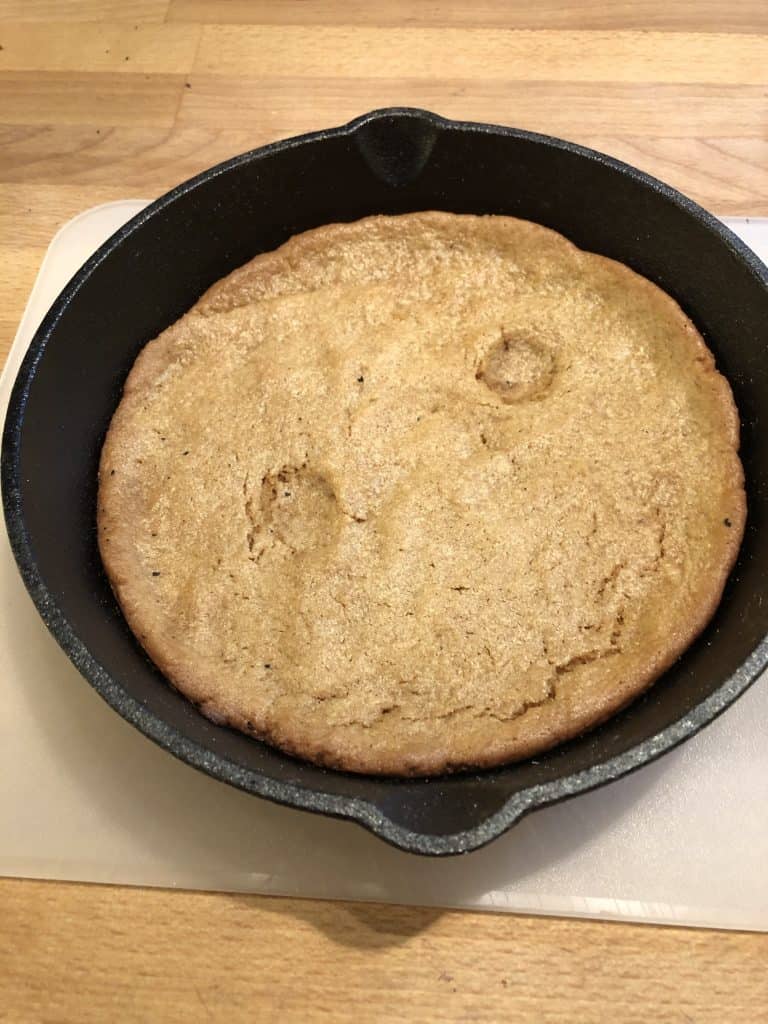 baked cookie in cast iron skillet