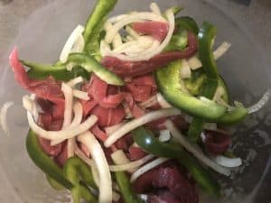 steak peppers and onions sliced for cooking
