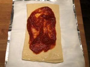 pizza sauce on dough