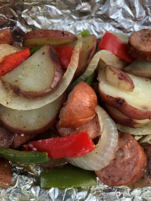 sausage peppers onions potatoes cooked in a foil packet