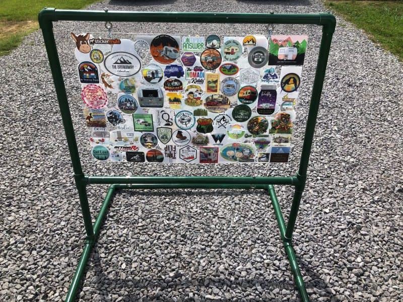 one board completely full of stickers set up on display outside