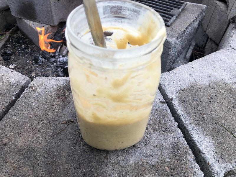 mason jar with batter for pie iron breakfast puffs