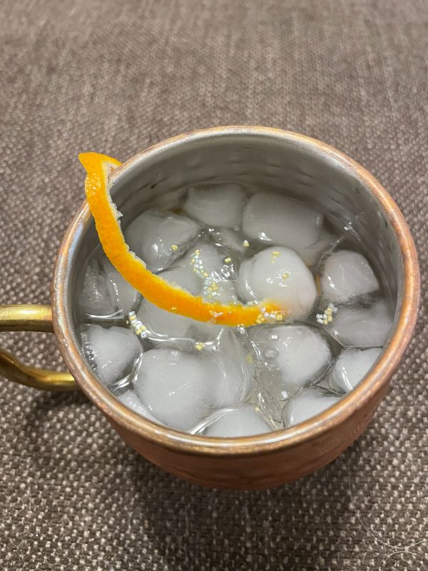 moscow mule in copper mug with orange peel